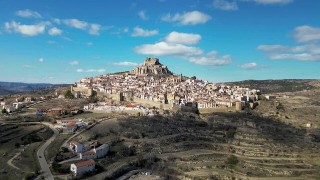 Cinematic aerial view of Morella city. Ancient walled city located on a hill-top in the province of Castell&oacute;n, Valencian Community, Spain. Drone going forward. Famous travel destination.