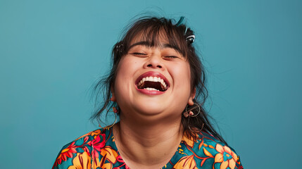 A Hispanic woman with Down syndrome laughing joyfully, displaying a sense of humor and happiness...