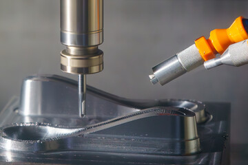 The CNC milling machine cutting  press die part by solid ball end mill tool.