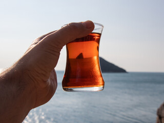 glass of turkish tea against island