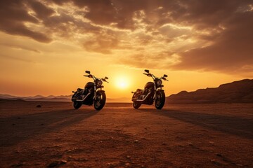 motorcycles are silhouetted against a sunset in a vast, tranquil desert,