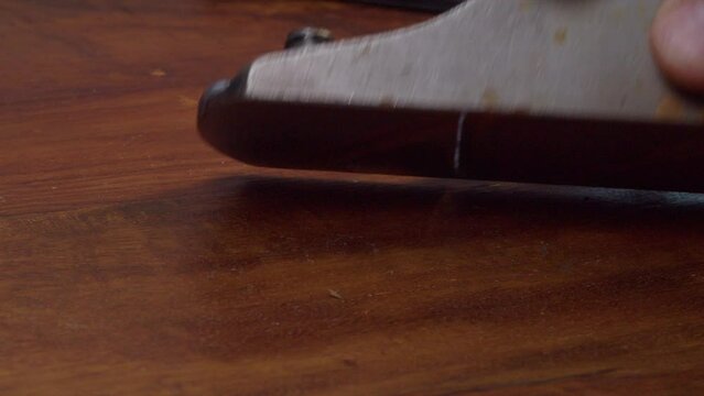 Close up view: Rusty antique wood plane reassembled after sharpening