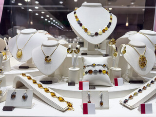 jewelry bracelets necklaces earring pearls and precious stones show in luxury retail store
