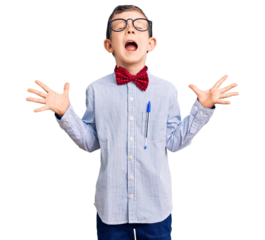 Cute blond kid wearing nerd bow tie and glasses celebrating mad and crazy for success with arms raised and closed eyes screaming excited. winner concept