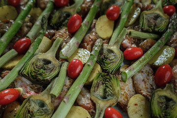 baby artichoke with asparagus and chicken mean fresh raw before cooking in oven, marinated side dish