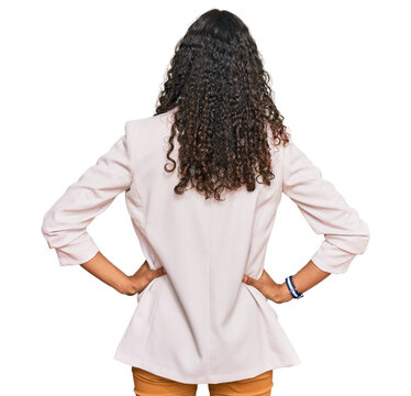 Young african american girl wearing business clothes standing backwards looking away with arms on body