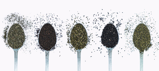Different types of tea in spoons top view on white background. black, green, herbal tea spoon....