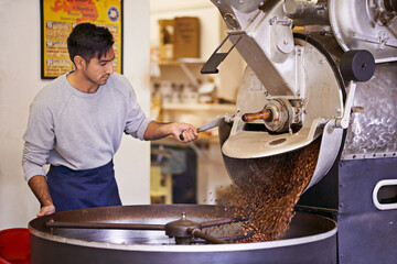 Coffee beans, process and man with machine for roasting with blending, production and quality...