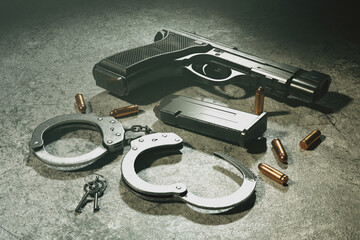 Black Semi-Automatic Handgun with Bullets and Handcuffs on Grey Concrete - obrazy, fototapety, plakaty