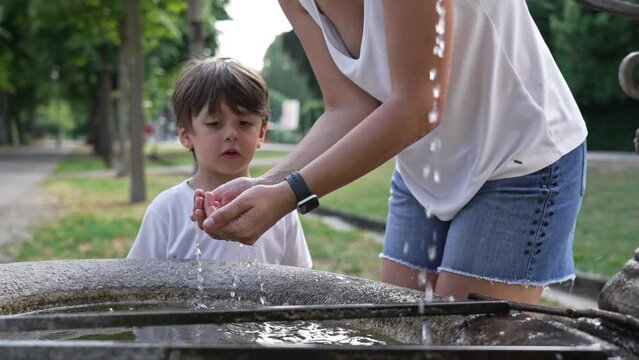 Mother&rsquo;s Love - Quenching Son&rsquo;s Thirst With Water From Fountain Collected In Her Hand
