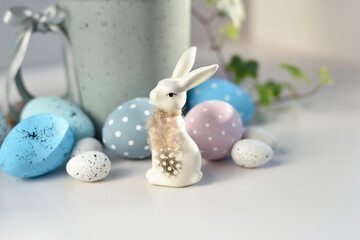 Easter composition with white rabbit and eggs on a white background. The minimal concept. - 767840351