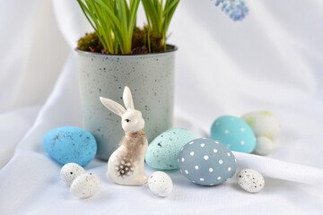 Easter composition with white rabbit and eggs on a white background. The minimal concept. - 767840384