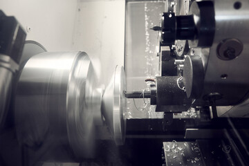 Multi tasking CNC lathe machine milling cut the metal shaft parts by milling spindle. High...