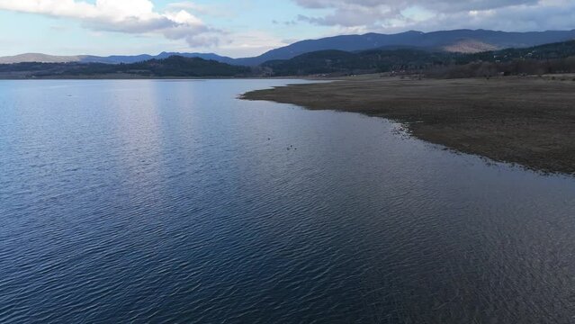 Drone shot of Batak Reservoir located in the Rhodope Mountains in the Batak municipality, Bulgaria