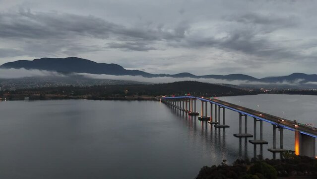 Drone shot of Tasman Bridge spanning the River Derwent at sunrise in Hobart, Tasmania, Australia