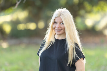 Naklejka premium Blonde Woman with braces Standing in Field