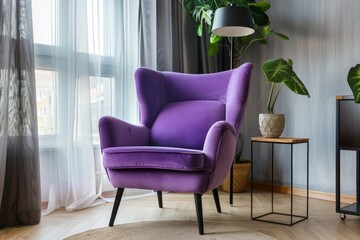 A luxurious violet armchair set against a backdrop of sheer curtains by a sunlit window, with vibrant green plants adding a touch of nature - obrazy, fototapety, plakaty