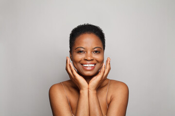 Cheerful wellness model woman with dark shiny skin and cute smile close-up portrait. - 767847352