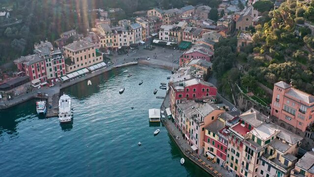 Top drone view of sun rays falling over Portofino touristic seaside village