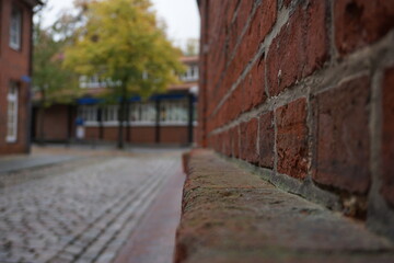 Fototapeta na wymiar Old stone wall in the old town