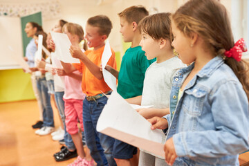 Elementary school students singing choir