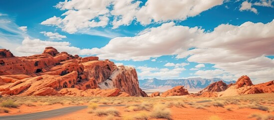 Valley of Fire State Park against a bright blue, cloudy sky - Powered by Adobe