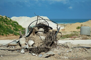 Construction debris in a dune near the seashore