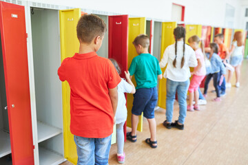 Students standing near lockers in hallway