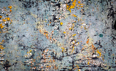 wall painted with colorful old peeling paints