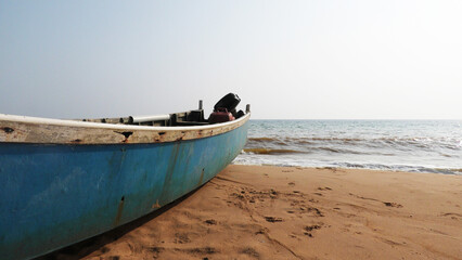 A fishing boat moored on the beach at Veli, Thiruvananthapuram, Kerala, India