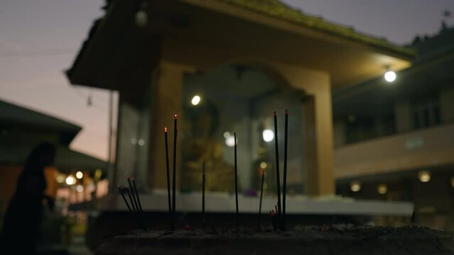 Burning smoking incense joss sticks at buddhist temple in Sri Lanka. Traditional offering in buddhist and hindu stupa. Spirituality concept. Meditation aroma sticks.