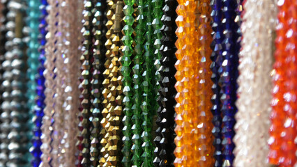 Colorful decorative pearl chains displayed in a shop