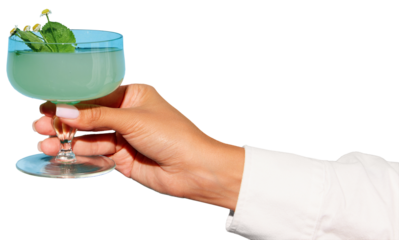 Female hand in green festive outfit holding glass with cocktail against transparent background. Concept of party, relax, alcohol, holidays, celebrations, Friday mood.