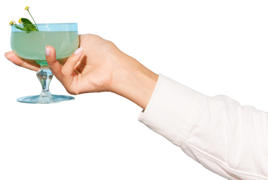 Woman's hand holding glass with gin tonic cocktail against transparent background. Copy space for ad. Concept of party, relax, alcohol, holidays, celebrations, Friday mood.
