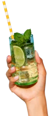 Fototapeten Lady's hand holding glass of cold, refreshing mojito with lime and bright straw against transparent background. Concept of party, relax, alcohol, holidays, celebrations, Friday mood. © Lustre