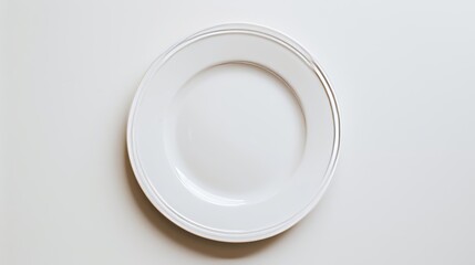 An image of a white plate placed against a white background