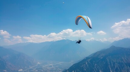 Paraglider soaring high with a breathtaking view of the mountains below, freedom theme no dust