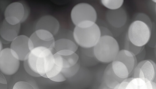 Abstract white and gray bokeh lights background with blurring lights for your design