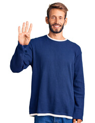 Handsome blond man with beard wearing casual sweater showing and pointing up with fingers number four while smiling confident and happy.