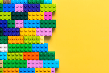 Naklejka premium Close up of colorful Lego blocks with space for text. Illustrative editorial