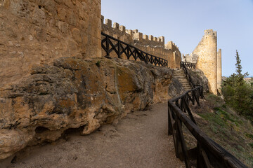 Castle of the medieval village of Peñaranda de Duero at sunset, Burgos, Spain. - obrazy, fototapety, plakaty