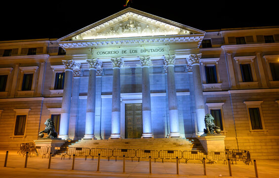Night view of entrance of Palace of Deputies of Spain building in Madrid.