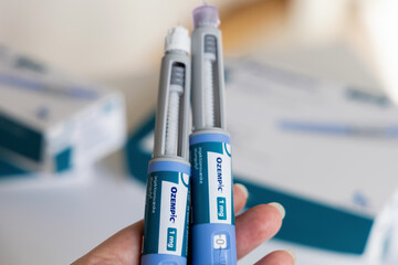 Hand holding Ozempic Insulin injection pen for diabetics. Denmark - March 25, 2024 - obrazy, fototapety, plakaty
