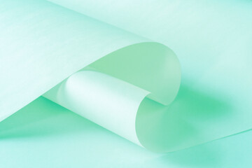 Sheets of paper from a roll of cold pastel color as a background.
