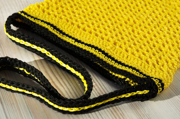 Yellow bag. Women's bag made of polyester cord for a table.