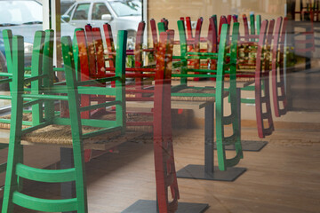 restaurant with a lot of green and red chairs