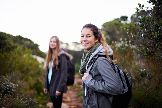Friends, women and smile in forest with hiking for adventure or leisure as fitness routine, exercise and workout in Australia. Portrait, outdoor and woods or hill with nature, peace and bonding