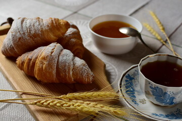 cup of tea and croissant