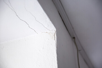 Close up of a crack on a white wall at home