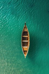 Wooden boat, seen from above, floating on water